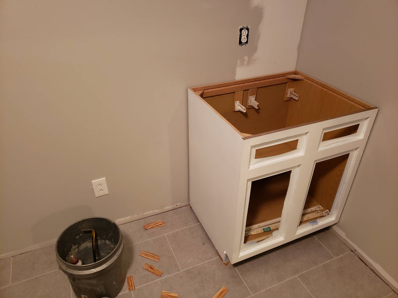 Walls out of square, how to align base cabinet?
